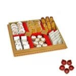 Mixed Delectables in a Decorated Tray with Diya